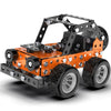 A black and orange DIY metal building block off-road vehicle or excavator engineering kit with large tires.