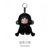 A black Skullpanda collectible figure with dark features and a silver hook.