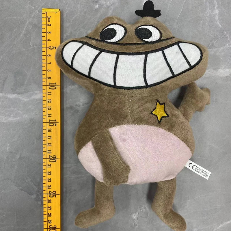 Brauchiger Plüschtiere, das eine Cartoonfigur mit großen Zähnen und einem gelben Stern zeigt, neben einem Lineal.