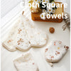 A set of five white cloth square towels for facial care, napkin, baby care, and hot compress.