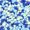 A close-up view of a variety of matte acrylic beads in shades of blue, white, and purple.