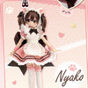 A pink and black doll named Nyako from the MEOW HOUSE line, featuring a frilly dress and dark hair.