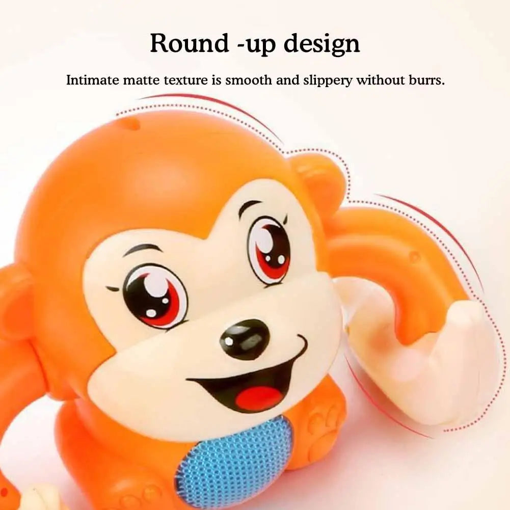 An orange interactive rolling monkey toy with a round-up design and smooth texture.