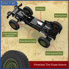 A black 1/12 scale 4WD RC rock crawler truck showing its metal chassis frame, suspension, and tires.