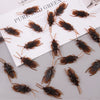 A collection of lifelike fake cockroaches in various shades of brown and black.