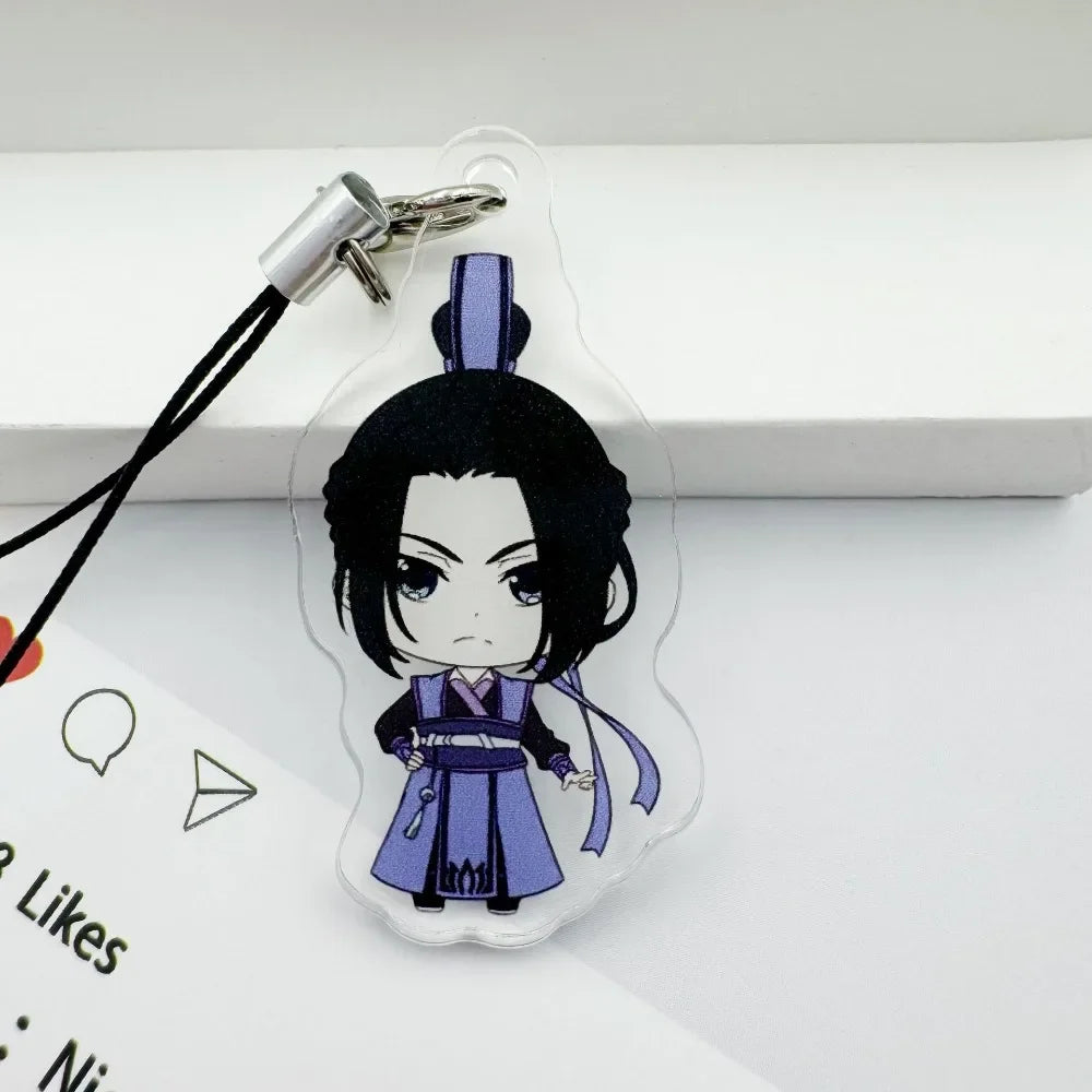 A clear acrylic pendant featuring a black-haired character in purple and blue attire attached to a silver keychain.
