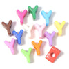 A collection of colorful acrylic letter beads shaped like the letter Y and O for DIY jewelry making