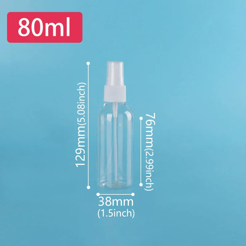 A clear glass refillable travel spray bottle with a fine mist pump, labeled 80ml.
