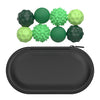 A set of six soft, textured silicone massage balls in various shades of green and lime green, displayed above a black storage