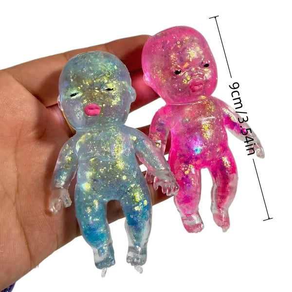 A pair of squishy fidget toys, one blue and one pink, are held in a hand with a measurement guide.
