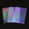 A stack of iridescent holographic card sleeves showing various rainbow and prismatic colors.