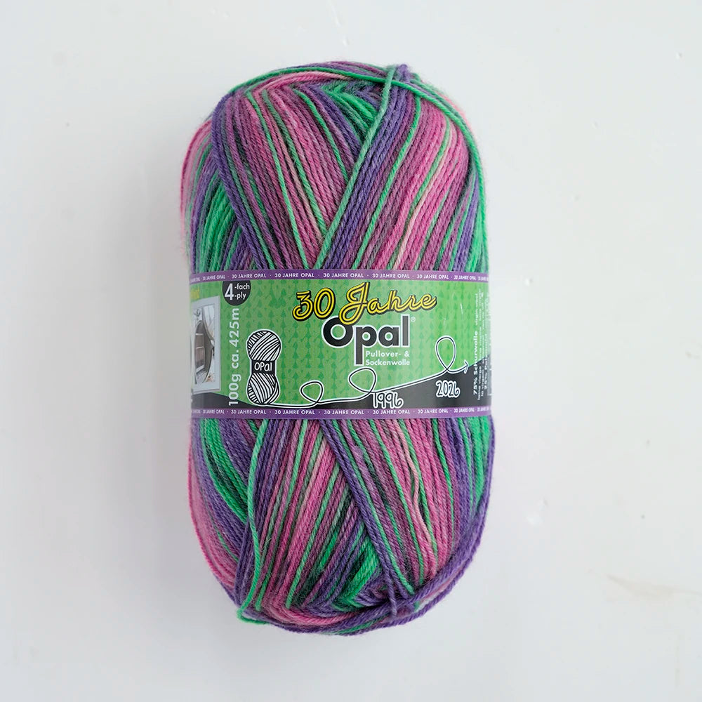A ball of 100g Opal 4-ply sock yarn in shades of pink, green, and purple.