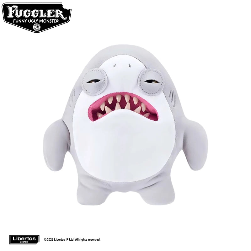 A gray plush toy resembling a tooth monster with large eyes and an open mouth.