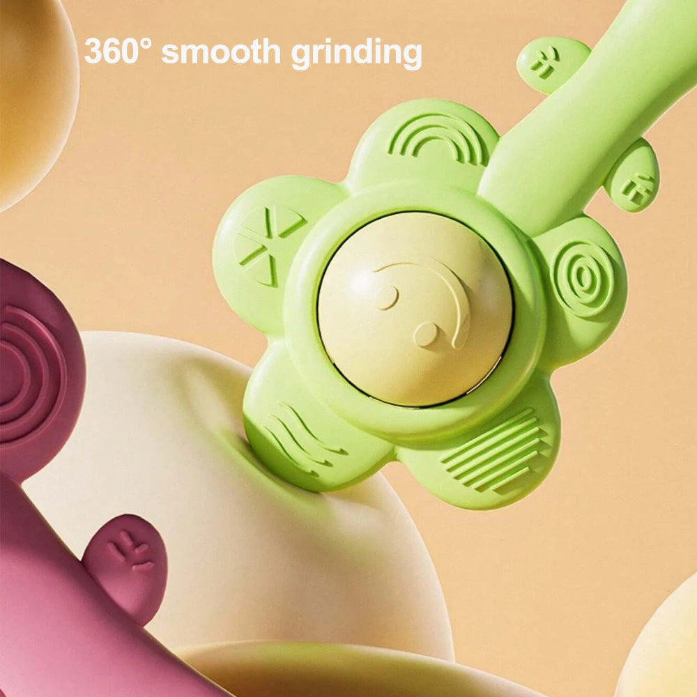 A close-up of a light green sensory teething rattle with a smooth grinding feature, shown in various shades.