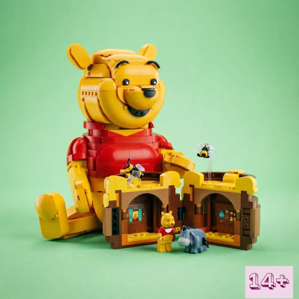 Gelbes Bären-Bauklötze-Set mit großer Bärenfigur und hölzernen Schlossstrukturen