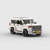 A white off-road vehicle model built from building blocks.
