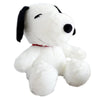A white Snoopy cartoon plush toy pillow with black ears and a smiling face.
