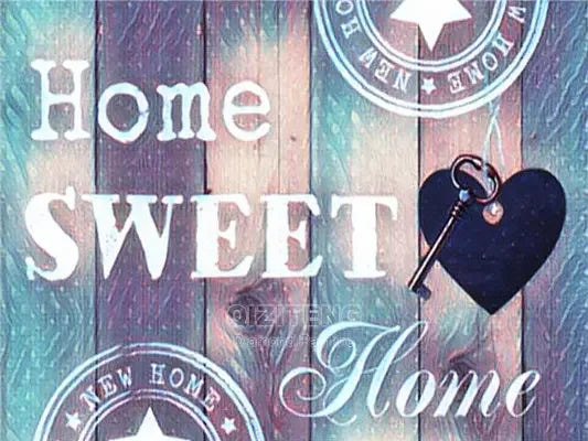 A wooden background with text reading Home Sweet Home and New Home, featuring a heart-shaped key.