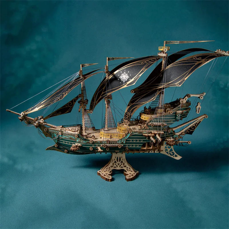 A detailed wooden puzzle model kit of a steampunk pirate ship with sails and rigging against a teal background.