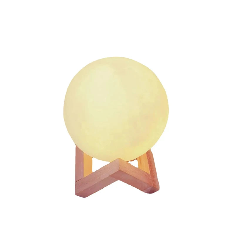 A round, glowing yellow night light shaped like a cute cartoon duck sitting on a wooden base.