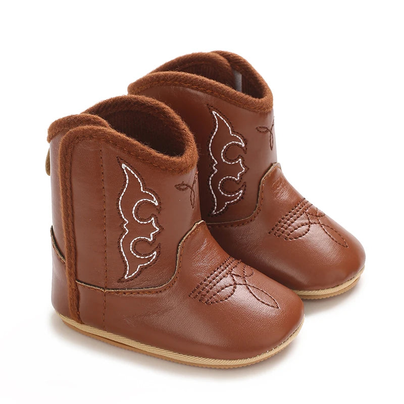 A pair of brown baby western booties with a soft non-slip sole.