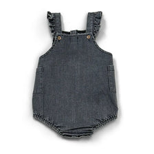 A dark gray denim romper with ruffled straps and patch pockets.