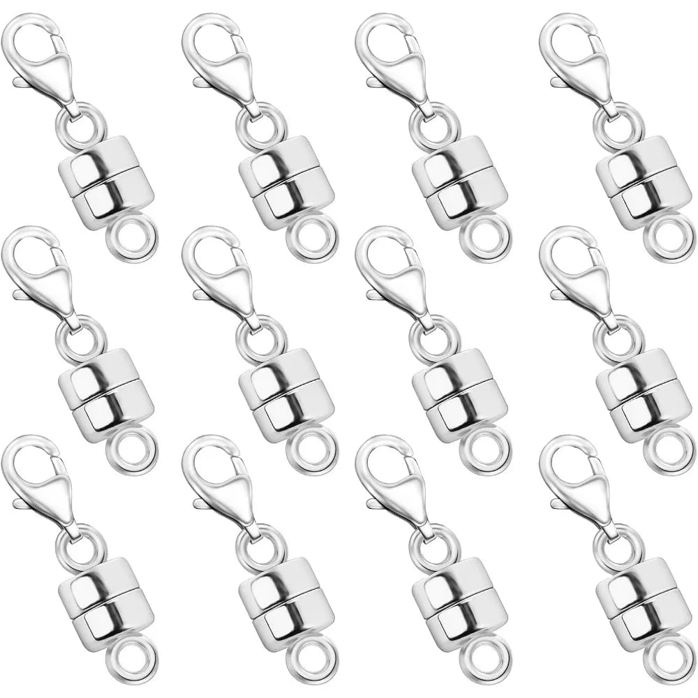 A collection of silver magnetic jewelry clasps for necklaces and bracelets.