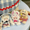 A close-up of Nommi Childhood Series blind box collectible dolls with fluffy fur and detailed clothing.