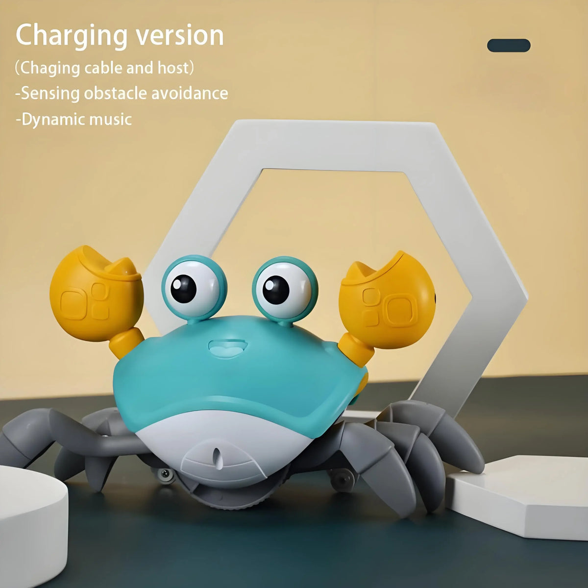 A light blue and gray crab toy with large eyes is shown inside a white hexagonal frame.