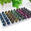 A collection of colorful, speckled dinosaur egg hatchings displayed in a clear plastic tray.
