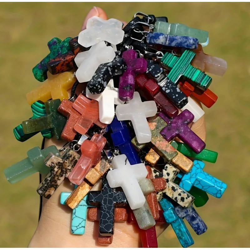 A collection of natural stone cross pendants in various colors and shapes for DIY jewelry making