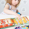 A baby is interacting with a Montessori word recognition quiet book featuring colorful letters and stickers.
