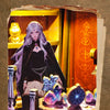 A dark-haired figure in a black cloak stands in a DIY book nook featuring LED lighting and mystical elements.