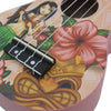A pink ukulele featuring a Hawaiian floral design and wood grain pattern.