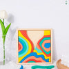 Rainbow wooden blocks puzzle pieces in various colors arranged on a white surface.