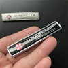 A silver and black emblem badge for Umbrella Corporation, featuring a red and white cross design.