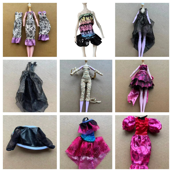 A set of fantasy monster doll accessories including a black lace dress, a gold outfit, and a pink sequined dress.