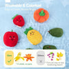A set of colorful, crinkly fruit and vegetable shapes floating in water for sensory play.