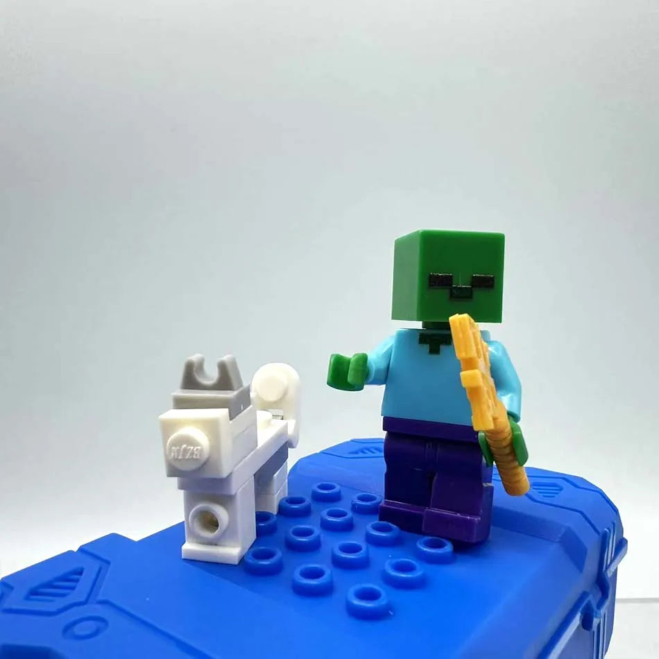 A Minecraft Steve PVC figure set featuring a green torso and head, blue arms, and purple legs, standing on a blue base.