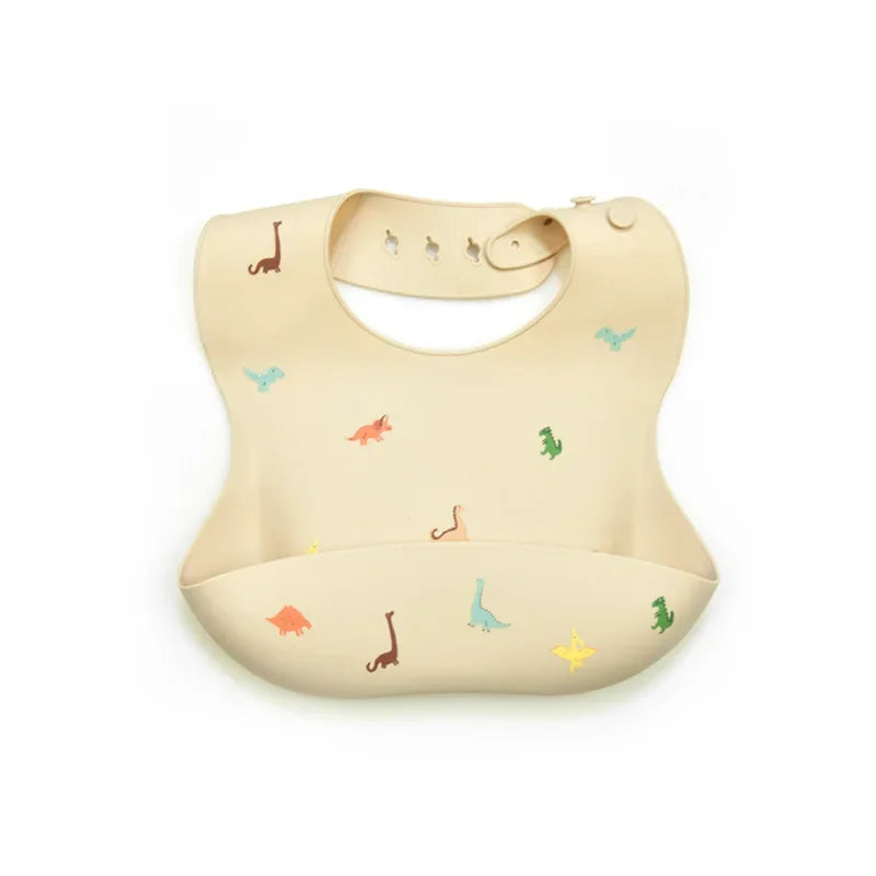 A beige soft silicone waterproof baby bib with an adjustable neck and small animal designs.