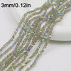 A close-up of multiple strands of clear crystal triangle beads for jewelry making