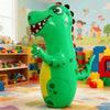 A bright green inflatable dinosaur punching bag standing on a colorful rug in a playroom setting.