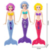 A set of four mermaid dive toys for pool fun featuring purple, blue, and yellow mermaids.