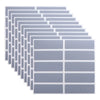 A stack of rectangular, translucent gray scratch-off sticker sheets arranged in a diagonal pattern.
