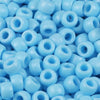 A close-up view of small, round blue pony beads for jewelry making and crafts.