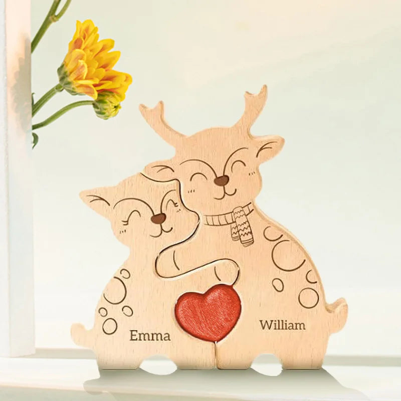 A wooden puzzle decoration featuring two elk figures with hearts and names Emma and William.