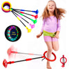 A girl is playing with a glowing ankle skip ball and various flashing LED light connectors.
