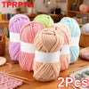 Two skeins of pink and peach chunky yarn for crochet and knitting projects