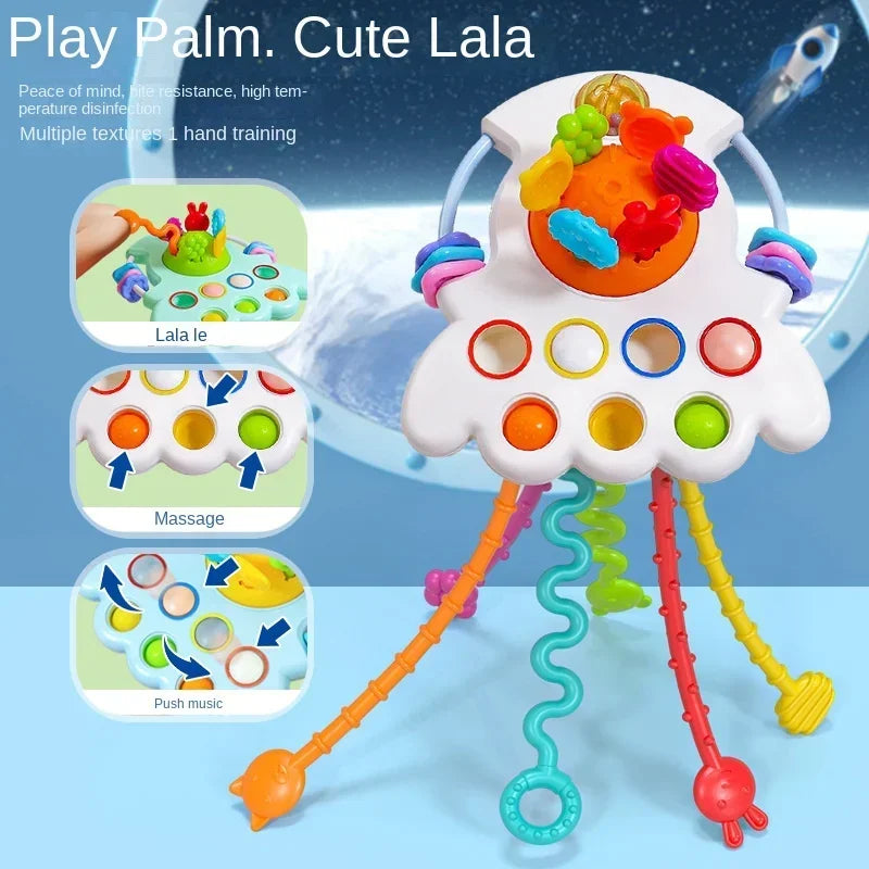 A white sensory pull string toy with multiple colored balls and strings for babies and toddlers.