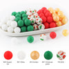 A variety of soft food-grade silicone beads in red, white, green, and gold are displayed in a white dish.